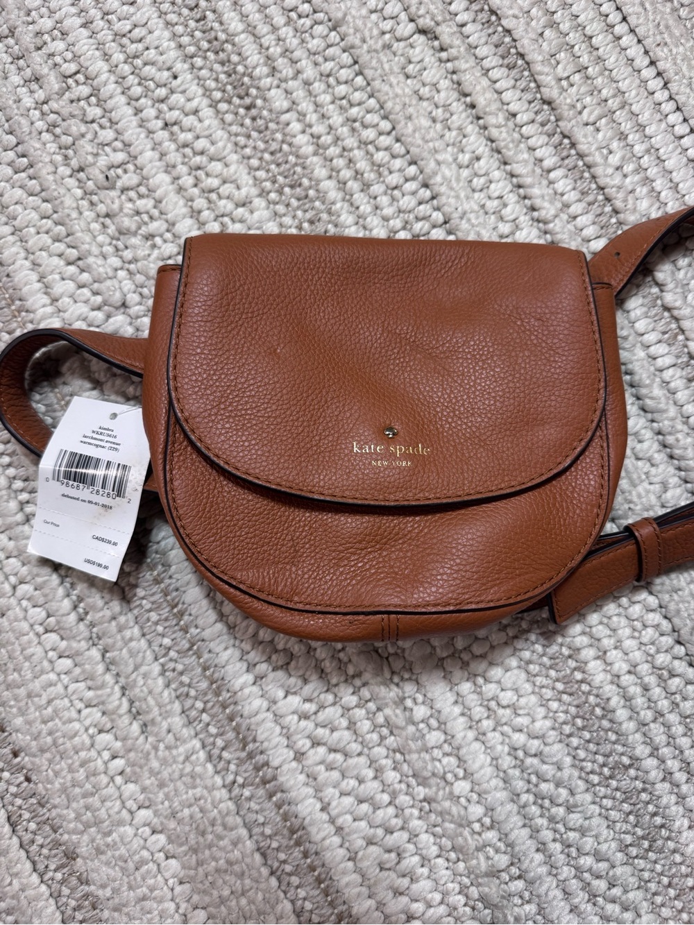 kate spade tan pebble leather crossbody saddle bag